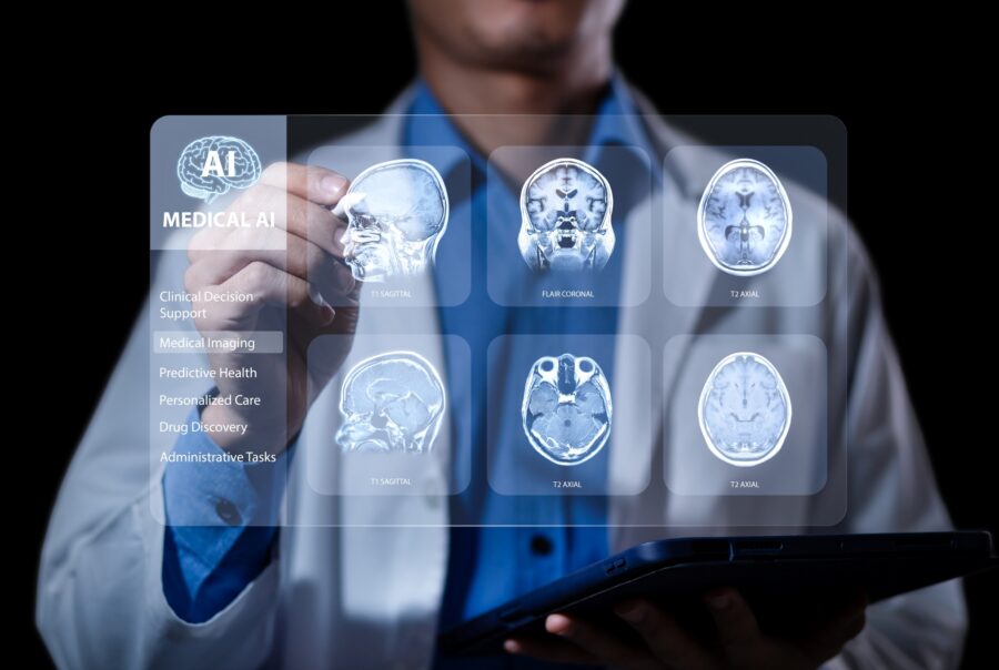 Close up of a doctor with radiological imaging scans in front of him